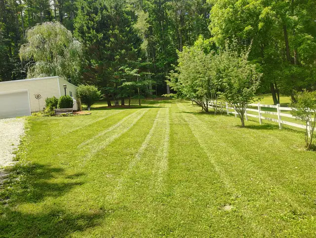 Mowed lawn with clean stripes, lawn care service in Asheville NC