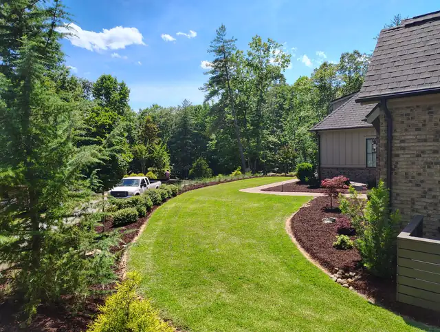 Fresh mulch installed in garden bed, Asheville NC