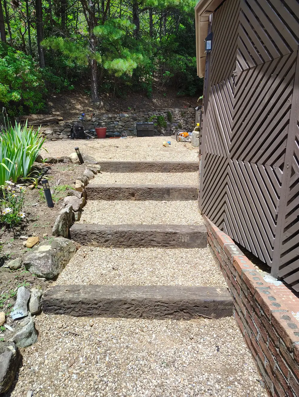 Timber and gravel steps built into a slope in Asheville, NC